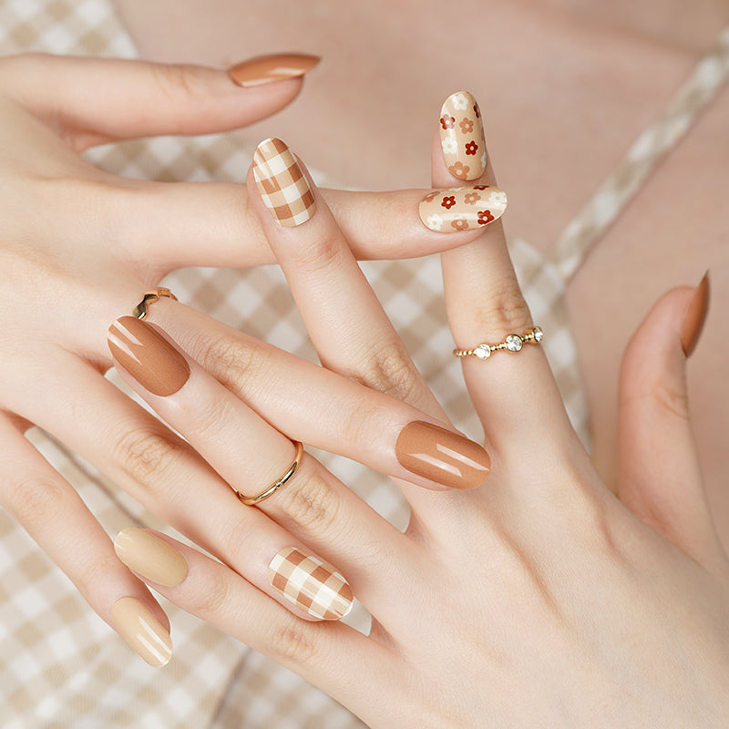 Classic beige and brown nails on natural hands, created with a DIY semi-cured gel sticker kit for an elegant, everyday manicure.