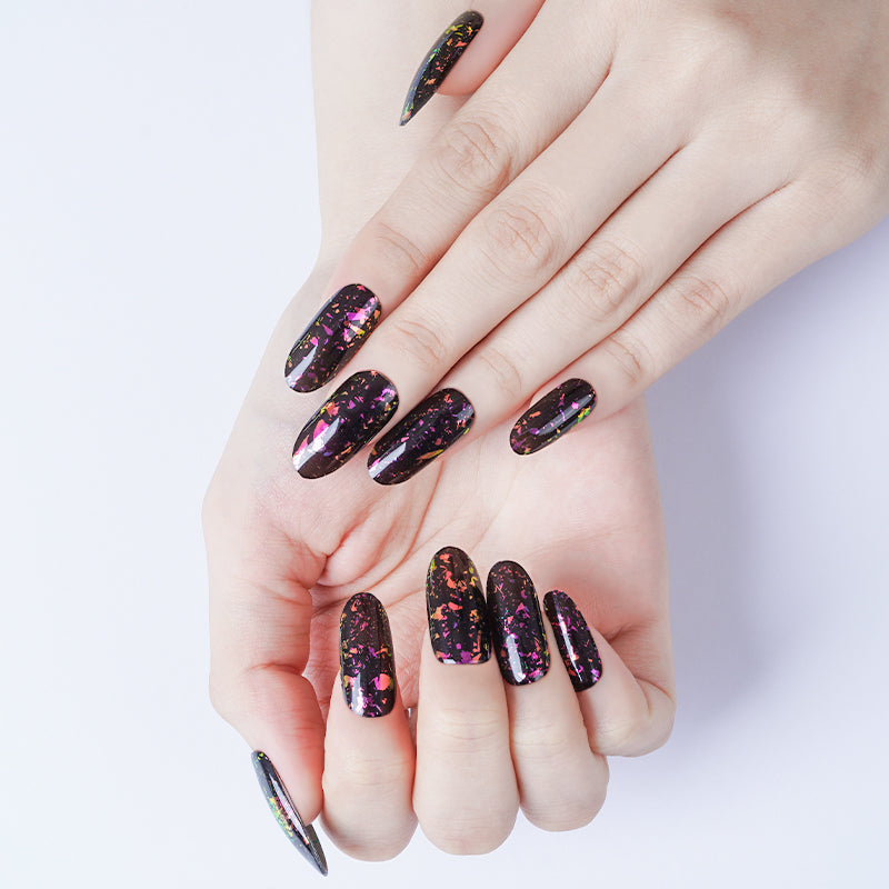 Vibrant magenta and sage marble nails on hands, created with a DIY semi-cured gel sticker kit for a bold, artistic manicure.